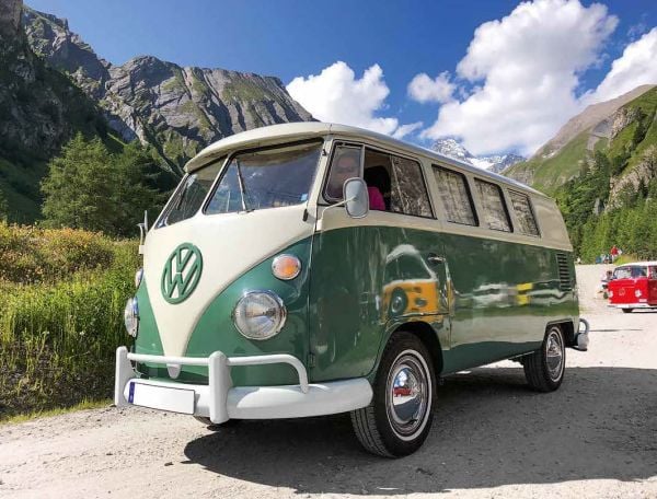 Book cover of 111 VW Bus Stories That You Should Know, with a yellow VW campervan with split-screen. Published by Emons Verlag.