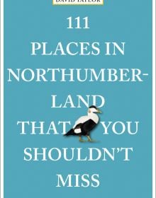 Black and white common eider duck, near centre of turquoise cover of '111 Places in Northumberland That You Shouldn't Miss', by Emons Verlag.