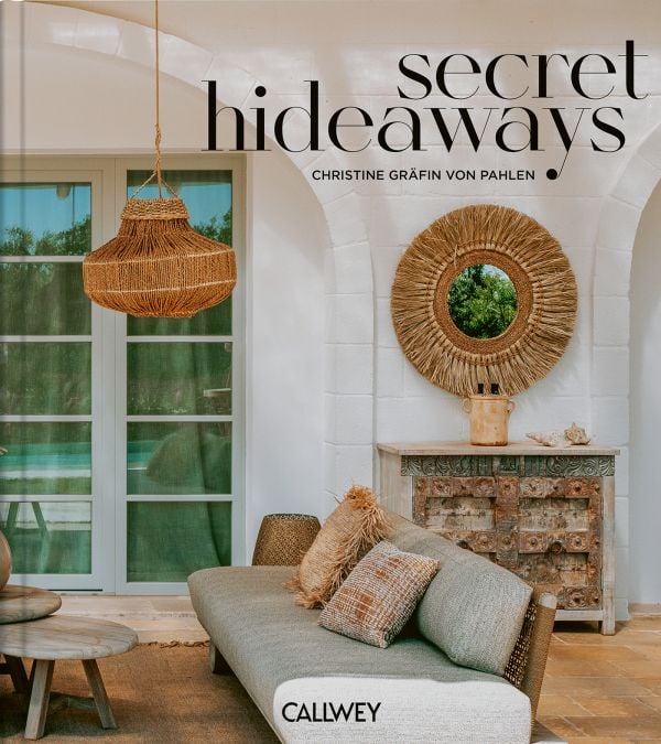 Book cover of Secret Hideaways; with interior living space with swimming pool outside. Published by Callwey.