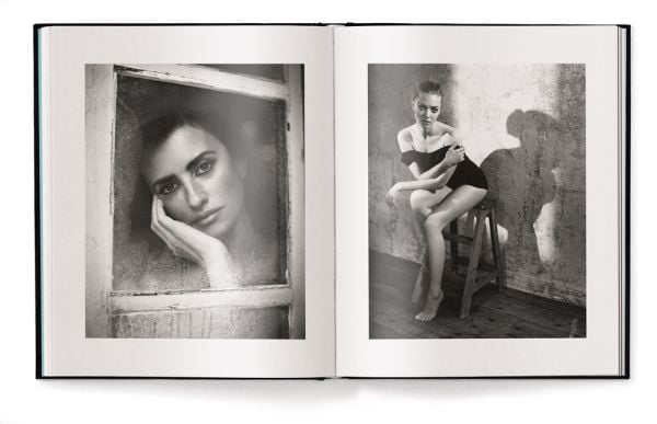 Nude white female model pulling on a white netted skirt, in studio space, Vincent Peters PERSONAL, in white font to lower left of centre cover.