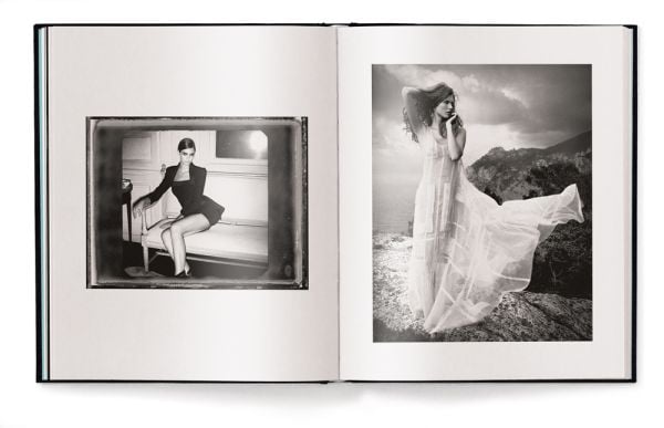 Nude white female model pulling on a white netted skirt, in studio space, Vincent Peters PERSONAL, in white font to lower left of centre cover.