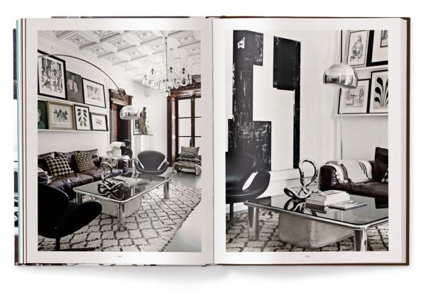 Interior space with wood dining table on rug, MOVE AND WORK, in white font above.