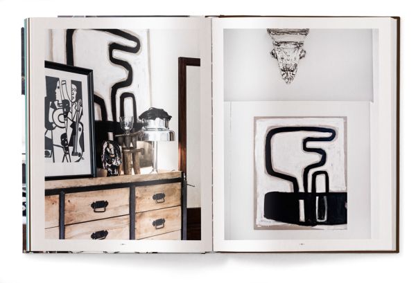 Interior space with wood dining table on rug, MOVE AND WORK, in white font above.