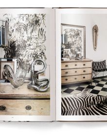 Interior space with wood dining table on rug, MOVE AND WORK, in white font above.