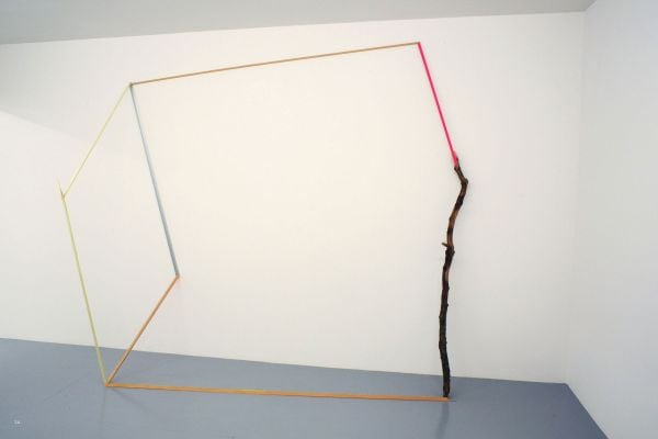 Black circle attached to smaller orange circle by fine thread on grey cover, Barbara Davi Train of Thought in white and black font above