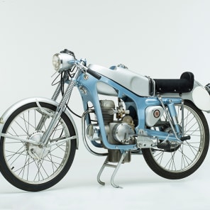 Black and white pattern of alpine mountains, DESIGN FROM THE ALPS 1920 2020 in black font to centre.