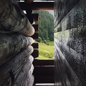 Book cover of Close-up - Ruch & Partner Architects 1994-2016, featuring a stone structure with mountainous landscape behind. Published by Scheidegger & Spiess.