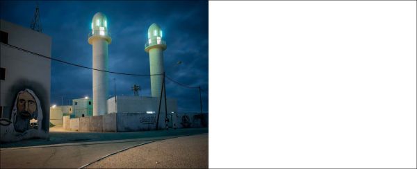 Book cover of Unresolved; with a camouflaged soldier leaning on building, with townspeople walk past brick building. Published by Scheidegger & Spiess.