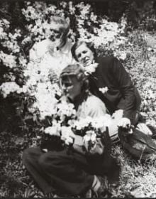 Bookshelf and table full of books and papers, The Giedion World Siegfried Giedion and Carola Giedion-Welcker in Dialogue in black font on bottom white banner