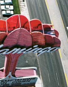 EYES THAT SAW in black font on white cover, with pink eye motifs dotted around text.