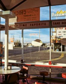 EYES THAT SAW in black font on white cover, with pink eye motifs dotted around text.