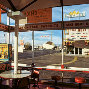 EYES THAT SAW in black font on white cover, with pink eye motifs dotted around text.