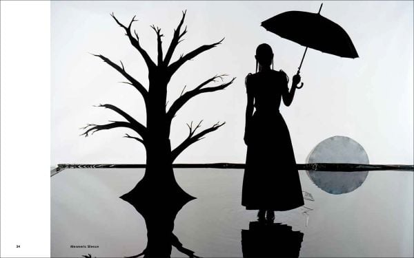 Back of female figure in red knickers, in-between a chair and pushbike, brown cover, Kuzma Vostrikov and Ajuan Song Absolutely Augmented Reality in black font above and below.