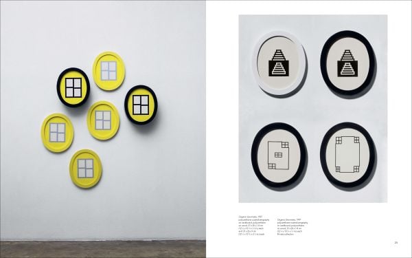 Geometric print of yellow flower shapes and blue lines joined to make squares, off white cover, HONG SEUNG-HYE ORGANIC GEOMETRY in blue font.