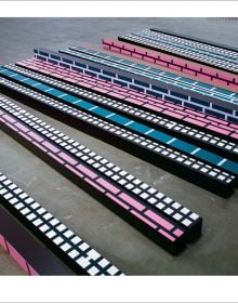 Geometric print of yellow flower shapes and blue lines joined to make squares, off white cover, HONG SEUNG-HYE ORGANIC GEOMETRY in blue font.