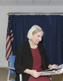 Newspaper front page with article headings, New Cut in black at top and American Readers at Home vertically on right in black font on white cover.