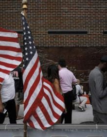 Newspaper front page with article headings, New Cut in black at top and American Readers at Home vertically on right in black font on white cover.