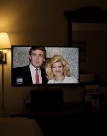 Newspaper front page with article headings, New Cut in black at top and American Readers at Home vertically on right in black font on white cover.