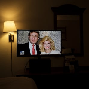 Newspaper front page with article headings, New Cut in black at top and American Readers at Home vertically on right in black font on white cover.