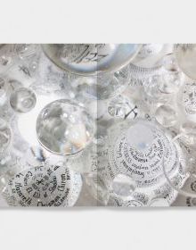 Book cover of Mary Bauermeister, Signs, Words, Universes, with convex glass with bubbles and notes in pen. Published by Verlag Kettler.