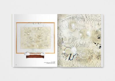 Book cover of Mary Bauermeister, Signs, Words, Universes, with convex glass with bubbles and notes in pen. Published by Verlag Kettler.