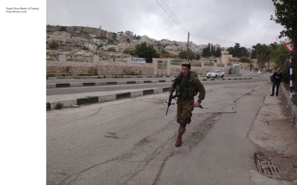 White book cover of Liu Xiaodong, Retrospective, featuring a painting of three figures on horseback, in open landscape. Published by Verlag Kettler.