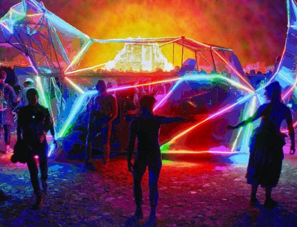 Landscape book cover of Romer + Romer, Burning Man/Electric Sky, with art installation shooting out fire into night sky, with crowds of people circling. Published by Verlag Kettler.