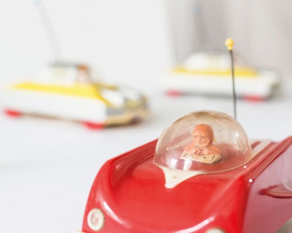 Landscape book cover of Cosmic Culture, Soviet Space Aesthetics in Everyday Life, featuring a Cosmonaut in helmet and suit, with drapes behind. Published by Verlag Kettler.