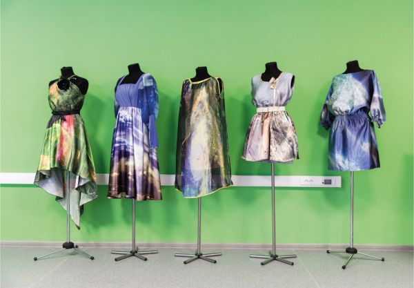 Landscape book cover of Cosmic Culture, Soviet Space Aesthetics in Everyday Life, featuring a Cosmonaut in helmet and suit, with drapes behind. Published by Verlag Kettler.