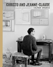Book cover of Christo and Jeanne-Claude: In/Out Studio, with young man perched on low stool in studio facing away from viewer. Published by Verlag Kettler.