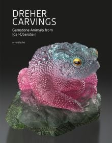 Book cover of Dreher Carvings: Gemstone Animals from Idar-Oberstein; with a colorful gemstone toad sculpture. Published by Arnoldsche Art Publishers.