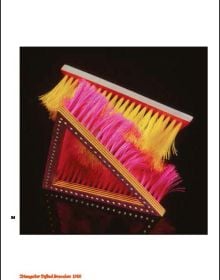 Panel of wood cubes threaded together, with tails of cubes attached, Caroline Broadhead in white font to top right