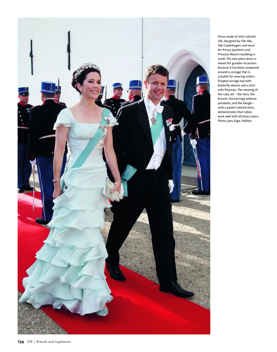 HRH Crown Princess Mary of Denmark in royal ruby parure, Royal Rubies in white font on raspberry left border