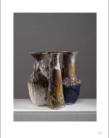 Rotated left image of glazed table sculpture, on grey cover, Johannes Nagel Trial and Error in white font above