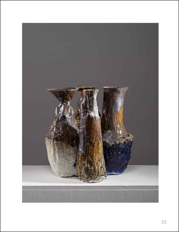 Rotated left image of glazed table sculpture, on grey cover, Johannes Nagel Trial and Error in white font above