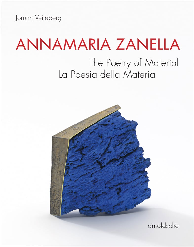 Bright blue jewellery piece, with bronze surround, on white cover Annamaria Zanella in red font above