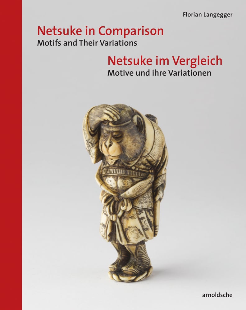 Netsuke of bear in robe, grey cover, Netsuke in Comparison in red font above, red left border
