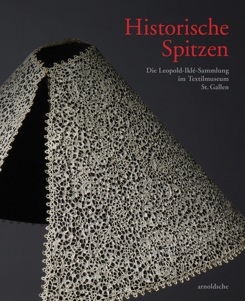 Intricately made ivory lace in cone shape, grey cover, Historische Spitzen in red to top right
