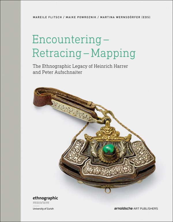Book cover of Encountering - Retracing - Mapping: The Ethnographic Legacy of Heinrich Harrer and Peter Aufschnaiter, with an antique Tibetan steel-flint kit with leather handle, and green stone. Published by Arnoldsche Art Publishers.