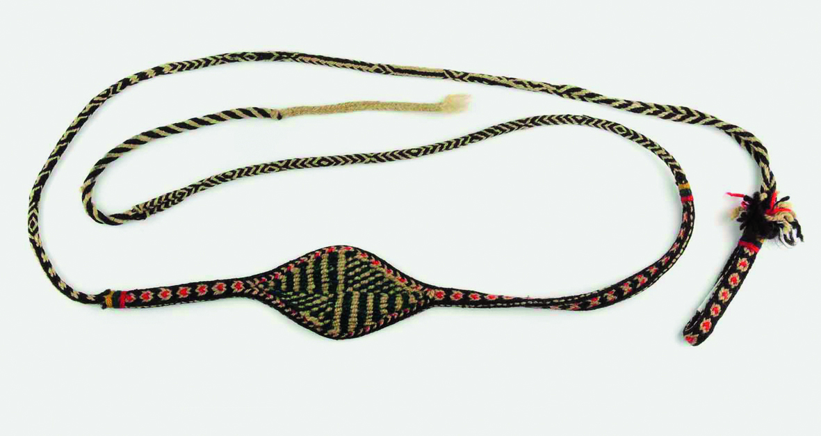 Book cover of Encountering - Retracing - Mapping: The Ethnographic Legacy of Heinrich Harrer and Peter Aufschnaiter, with an antique Tibetan steel-flint kit with leather handle, and green stone. Published by Arnoldsche Art Publishers.