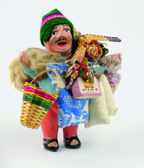 Book cover of Encountering - Retracing - Mapping: The Ethnographic Legacy of Heinrich Harrer and Peter Aufschnaiter, with an antique Tibetan steel-flint kit with leather handle, and green stone. Published by Arnoldsche Art Publishers.