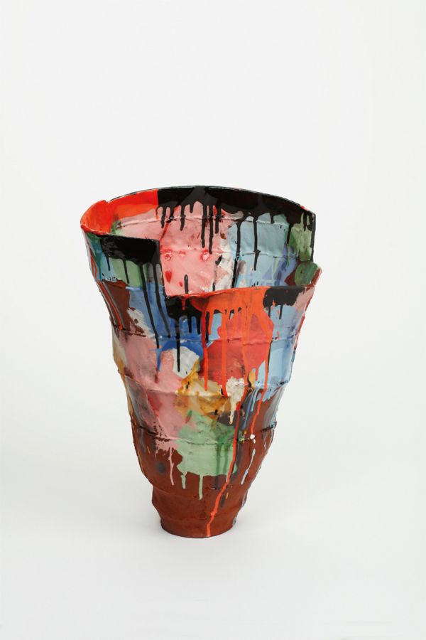 Glazed red ceramic wheel shape, on white cover, Vessel Sculpture 3 in dark red font to top