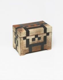 Glazed red ceramic wheel shape, on white cover, Vessel Sculpture 3 in dark red font to top