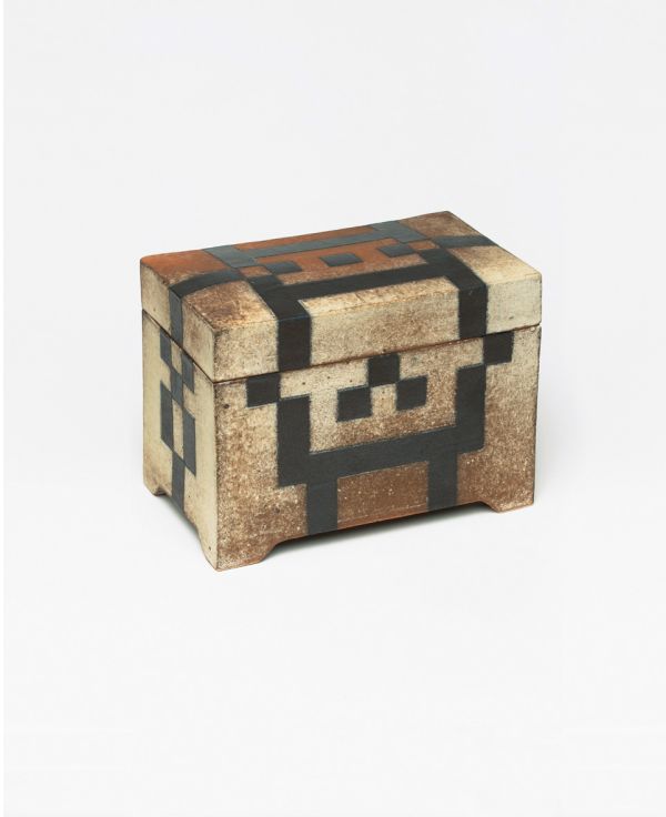 Glazed red ceramic wheel shape, on white cover, Vessel Sculpture 3 in dark red font to top