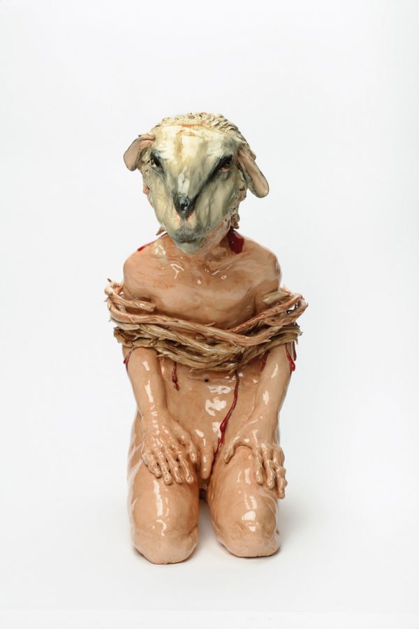 Glazed red ceramic wheel shape, on white cover, Vessel Sculpture 3 in dark red font to top