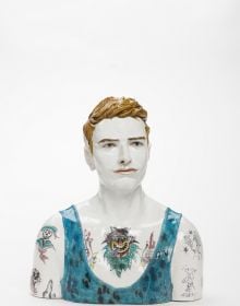 Glazed red ceramic wheel shape, on white cover, Vessel Sculpture 3 in dark red font to top