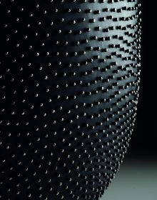 Book cover of David Huycke: Risky Business. 25 Years of Silver Objects, with a decorative sphere-shaped metal sculpture. Published by Arnoldsche Art Publishers.