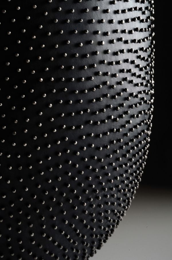 Book cover of David Huycke: Risky Business. 25 Years of Silver Objects, with a decorative sphere-shaped metal sculpture. Published by Arnoldsche Art Publishers.