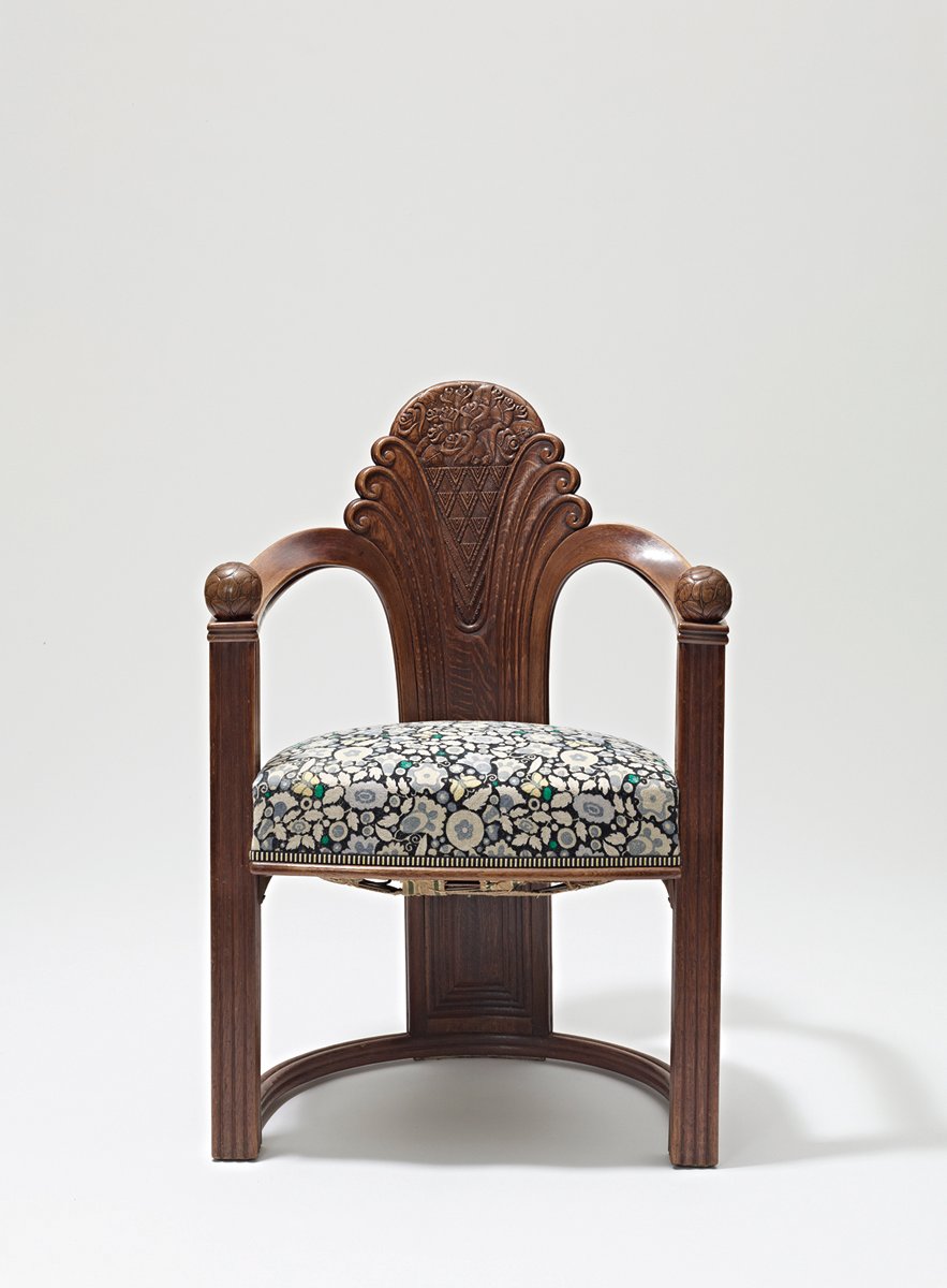 Otto Prutscher sitting in chair, superimposed on blue cover surrounded by product designs and patterns, OTTO PRUTSCHER in black font above.