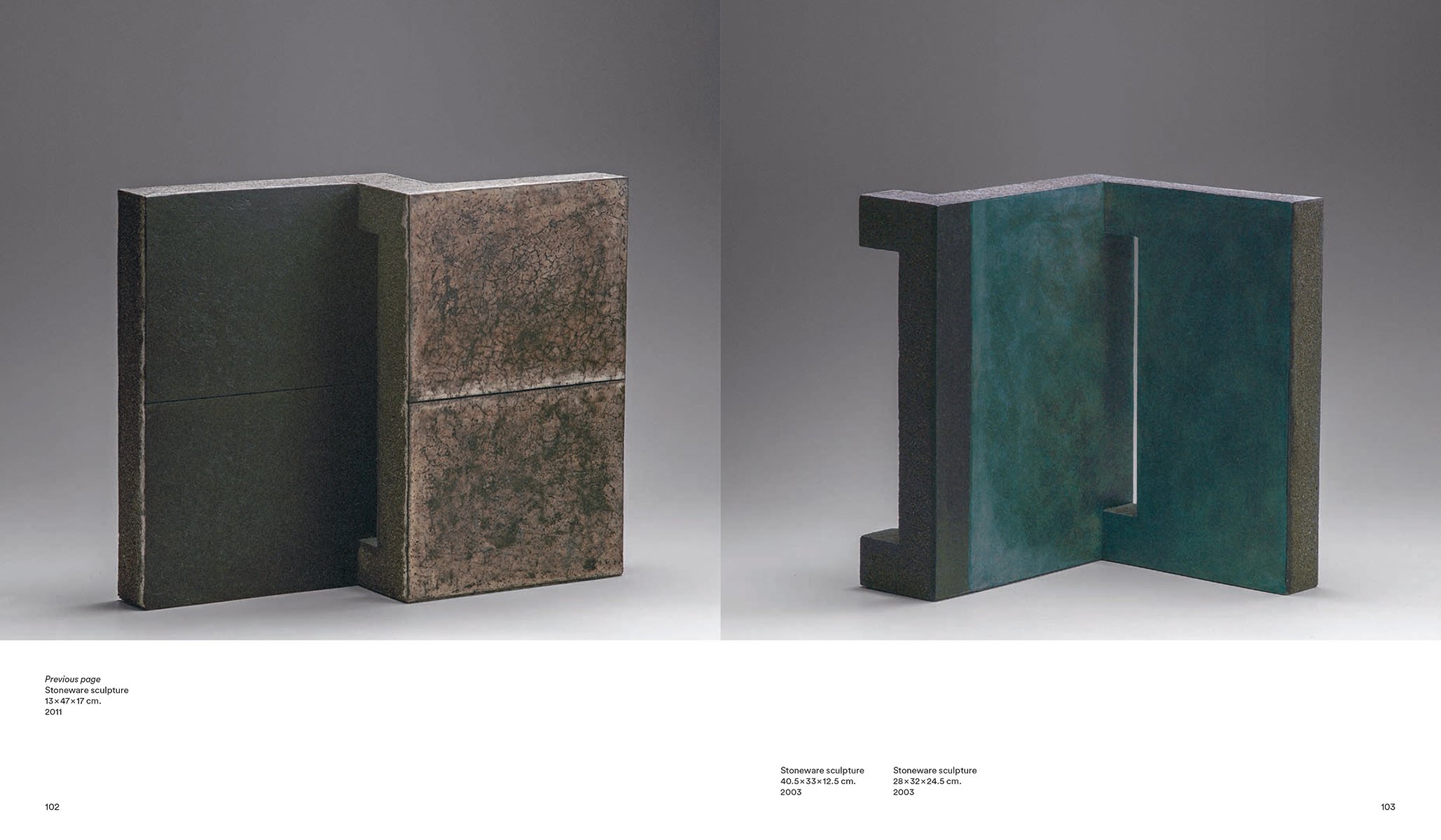 Black stoneware brick sculpture, on white cover, Enric Mestre in white font above.